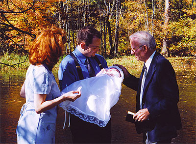 Grandpa dedicating Lauren in 2003